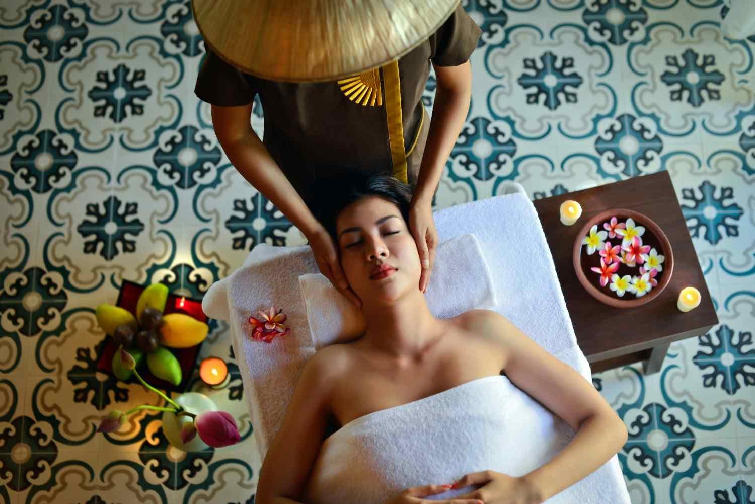 Therapist performing traditional Dry Thai massage stretch therapy